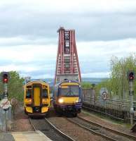 158 and 170 units pass just north of Dalmeny station on 23 May with work in progress on The Bridge in the background.<br><br>[Brian Forbes 23/05/2009]