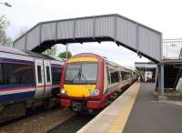 Colour clash at Dalmeny as a pair of 170s restart from the platforms there on 23 May 2009.<br><br>[Brian Forbes 23/05/2009]