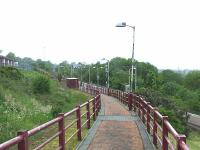 Looking West at Whinhill station in Greenock. The station occupies the site of the trackbed that ran along the second Cartsburn Tunnel, now disused. <br><br>[Graham Morgan 23/05/2009]