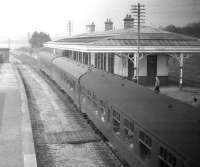 The returning <I>Formartine and Buchan Excursion</I>, with D5323 in charge, makes a photostop at Ellon on 24 May 1969. View is north towards Maud Junction. The old goods yard and Boddam branch line were on the right of the island platform.<br><br>[Robin Barbour Collection (Courtesy Bruce McCartney) 24/05/1969]
