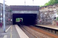 <I>Light at the end of the tunnel</I> as Motherwell bound 318254 approaches the platforms of Cambuslang station on 3 June.<br><br>[John Steven 03/06/2009]
