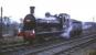 Class J36 no 65345 in the process of running round <I>Scottish Rambler No 5</I> in Westfield Loop on 11 April 1966. The locomotive had taken over the train from J38 no 65914 at Bathgate Junction and was in charge for the rest of the tour, including the journey back to St Enoch. (With thanks to Messrs Gibb and Crawford for finally nailing this location on their walk [see image 23042]). [Editors note: Stan Bell tells me that this locomotive (Thornton Junction's <I>pet</I>) hauled the last BR scheduled steam working in Scotland from Seafield Colliery. The locomotive is generally recorded as being 'officially' withdrawn from Thornton shed in June 1967.]<br>
<br><br>[Robin Barbour Collection (Courtesy Bruce McCartney) 11/04/1966]