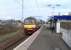 Rear view of 320 311 as it pulls out of Alexandria on 1 April 2009 with the last leg of a service to Balloch.<br><br>[David Panton 01/04/2009]