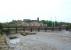 Formerly an overhead electrified rail route, Greyhound Bridge on the other Lancaster to Morecambe line closed to trains in 1966 and was soon converted for road traffic. This view from the site of Lancaster Green Ayre station, alongside the River Lune (at low tide), also shows the Castle and the Priory church on the hill behind. <br><br>[Mark Bartlett 24/04/2009]