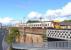 A westbound EMU heads for Partick on the urban viaduct alongside the Clydeside Expressway at Queens Dock on 10 May 2009. <br>
<br><br>[Colin Miller 10/05/2009]