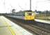 First week of operations at the new Wallyford station in June 1994 as 305 519 calls with a North Berwick - Edinburgh Waverley service.<br><br>[David Panton 19/06/1994]