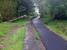 The platform at the former Ballachulish Ferry station (closed March 1966) is still in surprisingly good condition, with the trackbed for several miles westward having now been converted to a pedestrian/cycle track by Sustrans (the long term ambition being to link up the entire stretch to North Connel). The old platform is seen here looking east along the trackbed in May 2009.<br>
<br><br>[Tony White /05/2009]