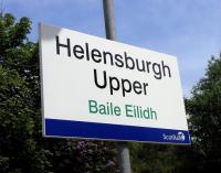 Platform sign at Helensburgh Upper on 2 June 2009. [The Gaelic version omits the 'Upper'.]<br><br>[David Panton 02/06/2009]