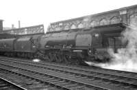 Stanier <I>Coronation</I> Pacific no 46250 <I>City of Lichfield</I> stands in the rain at Carlisle's platform 4 ready to take out special troop train 1X68. <br><br>[K A Gray 30/05/1964]