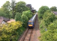 Ten minutes after leaving Perth on 13 June, a southbound First Scotrail DMU en route to Edinburgh runs past the site of Bridge of Earn station.<br><br>[David Forbes 13/06/2009]