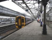 An Inverness service, formed by 158 716, prepares to leave Aberdeen platform 7N on 15 June 2009. Note the abandoned platforms 8 & 9 behind the fence to the right where a single through line now runs along the centre of the formation.<br><br>[David Panton 15/06/2009]