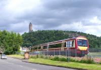An SPT liveried 170 rounds the bend towards the Wallace Monument on 18 June with a service for Alloa.<br><br>[David Forbes 18/06/2009]