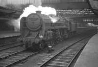 BR Standard class 6 Pacific no 72007 <I>Clan Mackintosh</I> stands on the centre road at Carlisle in April 1964 waiting to take over the 9.25am Crewe - Perth train.<br><br>[K A Gray 11/04/1964]