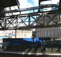 View north over the east end of platform 1 at Waverley towards the Calton Road entrance on 18 June 2009. The stone piers that supported the former elevated walkway to Jeffrey Street stand in the background, while the gap in the station roof remains. [See image 9634]  <br>
<br><br>[Al Strachan /06/2009]