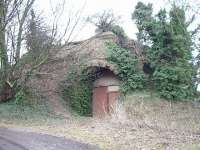 Remains of the old Harelaw limekiln at Longniddry in January 2003. Once rail connected (with its own internal tramway) to the Haddington branch. Harelaw Lime Works.<br>
<br><br>[James Young 18/01/2003]