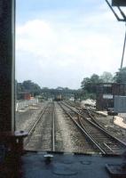 Second man's window view at Dorchester South in May 1985 as a Weymouth bound train approaches the station. Note the ex-SR signal box on the right.<br><br>[John McIntyre /05/1985]