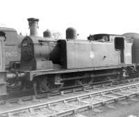 McIntosh 0-6-0T no 56302 stored in sidings alongside Dumfries shed awaiting disposal in April 1963.<br><br>[David Pesterfield 13/04/1963]