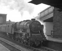 Rebuilt <I>Patriot</I> 4-6-0  no 45545 <I>Planet</I> stands with what is thought to be the 9.43am Liverpool - Glasgow Central train at the north end of Carlisle station in April 1963. The locomotive was transferred from Crewe North to Upperby 12 months earlier and stayed until finally withdrawn by BR in 1964. Disposal was via Connels of Coatbridge in September of that year.<br>
<br><br>[K A Gray 12/04/1963]