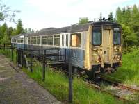 Railbus prototype no 140001 stored west of Dufftown station in June 2009. The track ends just ahead of the unit and the trackbed is then blocked by an access road into the adjacent distillery complex. [See image 24656]<br><br>[David Pesterfield 26/06/2009]