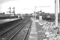 View east from the platforms at Gilmour Street station in June 1966 with electrification work well underway. In the background a pair of Claytons can be seen passing Wallneuk Junction signal box with a westbound freight on the Ayr line.<br><br>[Colin Miller /06/1966]