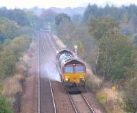 A <i>Railhead treatment train</i> approaches MidCalder Jct with Livingston south station in the background in October 2005<br><br>[James Young 15/10/2005]
