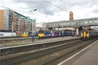 A busy scene at Manchester Oxford Road on 8 July 2009 with three trains waiting to depart. From Left to right a Class 142 in the bay platform waits to head to Liverpool with a stopping service. Next is a Class 150 on the rear of a service to Manchester Airport with another Class 142 leading. On the right is a service to Barrow.<br><br>[John McIntyre 08/07/2009]