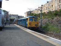 87002 heads the return leg of the 'Electric Scot' railtour through Queens Park on 11th July. When was the last time a class 87 passed through here?<br><br>[Michael Gibb 11/07/2009]