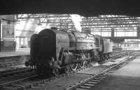 70002 <I>Geoffrey Chaucer</I> simmers beneath the footbridge at Carlisle on 18 April 1964 after arriving light engine from Kingmoor shed. The locomotive is awaiting the 9.25am Crewe - Perth train which it will work north.<br><br>[K A Gray 18/04/1964]