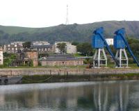 The old Edinburgh & Northern station buildings and a pair of disused cranes, seen from across the dock at Burntisland on 14 June 2009. [Unknown to me at the time the cranes were about to become history and have since vanished.] <br>
<br><br>[David Panton 14/06/2009]