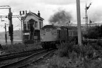 Passing Craigendoran SB, 27042 comes through Craigendoran with a service for Glasgow Queen St from the West Highland line in 1974.<br><br>[John McIntyre //1974]