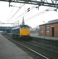 25023 runs east through Guide Bridge station on 11 April 1980.<br>
<br><br>[Peter Todd 11/04/1980]