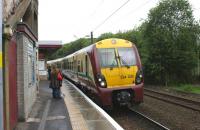 334020 enters Hyndland station at 1117 hrs with a Dalmuir to Larkhall service on a rather dreich 27 July 2009.<br><br>[John McIntyre 27/07/2009]