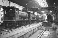 North Eastern line up inside the repair shop at Gateshead on 24 October 1964 with 65791 nearest the camera on the left, 65832 beyond that and 63455 at the end of the line.<br><br>[Robin Barbour Collection (Courtesy Bruce McCartney) 24/10/1964]