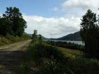 This view is about three miles from St Fillans showing the trackbed on the left, Loch Earn on the right and St Fillans in the centre distance.<br><br>[John Gray 30/07/2009]