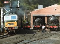 Hymek D7029 accelerates south from Grosmont tunnel on 21 August 1984 with a train for Pickering, passing 69023, 45428 and 62005 standing on shed.<br><br>[David Pesterfield 21/08/1984]