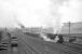 One of the rebuilt ex-Crosti 9Fs pulls out of the down loop at Beattock with a Shap - Ravenscraig limestone train in April 1965. The train has just been joined at the rear by BR Standard class 4 2-6-4T no 80045 prior to tackling the climb north [see image 34386].<br><br>[Robin Barbour collection (Courtesy Bruce McCartney) /04/1965]