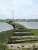 The piers are all that is left of the Hayling Island timber railway bridge. Weight restrictions on the bridge meant the line was worked by tiny A1X class tank engines, nicknamed <I>Terriers</I>, which were originally designed for South London suburban services. The line was closed by BR in 1963.<br><br>[Alistair MacKenzie 17/06/2009]