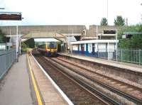 A late (1941) addition to the railway network, this station is Hilsea on the busy Portsmouth line. SWT 450075 is heading for Portsmouth as it draws into Hilsea in this view looking northwards. <br><br>[Mark Bartlett 18/06/2009]