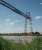 Similar in operation to, but 11 years older than, its Middlesbrough counterpart [See image 59948] this is Rochefort transporter bridge over the River Charente. Built in 1900 it has been replaced by a motorway viaduct in recent years but still operated by the local government region as a preserved industrial monument.<br><br>[Mark Bartlett 24/06/2009]