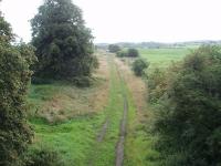 The view east along the former trackbed to Wennington from the overbridge at the site of Hornby station in the Lune Valley. The Lancaster to Wennington line has been closed for over 40 years now but the trackbed is still easily visible for most of its length. <br><br>[Mark Bartlett 14/07/2009]