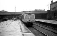 Looking south along platform 6 at the north end of Aberdeen Joint station as a Swindon DMU waits to depart for Inverness on 9 June 1973. The old GNoS booking office is on the right and the main part of the station is beyond Guild Street bridge. Hopefully the tail lamp will be moved to the rear of the train before departure!<br><br>[John McIntyre 09/06/1973]