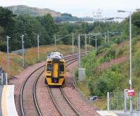 A Bathgate-Edinburgh service approaches Livingston North station on 17 August 2009. <br><br>[James Young 17/08/2009]