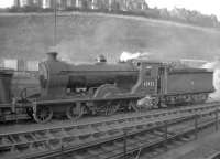 Reid D30 <i>Scott</i> class 4-4-0 no 62423 <I>Dugald Dalgetty</I> stands in the shed yard at Hawick in 1957. The locomotive was withdrawn from here in December of that year and cut up at Inverurie works the following month.<br>
<br><br>[Robin Barbour Collection (Courtesy Bruce McCartney) 02/11/1957]