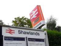 Photograph taken at Shawlands station on 8 August 2009 showing the orange image before last, and in front of it, the pre-Strathclyde branding image before that.<br><br>[David Panton 08/08/2009]