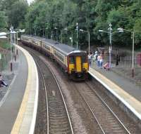 A 4-car 156 pulls into Thornliebank with an East Kilbride - Glasgow service on Saturday 8 August 2009. Now a mad dash so I can catch it...<br><br>[David Panton 08/08/2009]