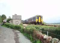 A little to the east of Kents Bank station is a level crossing affording tractors access to the foreshore. The crossing cottage still stands but these days the barriers are 'user operated'. 156444 heads for Lancaster on a Northern coastal service.<br><br>[Mark Bartlett 24/08/2009]