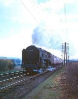 Britannia Pacific no 70046 <I>Anzac</I> photographed shortly after passing below the road bridge (in background) just to the north of Beattock station with a down train in the mid 1960s.<br><br>[A Snapper (Courtesy Bruce McCartney) //]