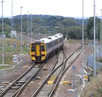 The daily Edinburgh - Alloa direct service leaves the EGML at Polmont Junction on 2 September. Note the floodlights that have recently been installed here, as at other EGML junctions.<br><br>[David Panton 02/09/2009]
