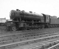 Ex-WD 2-10-0 no 90756 stands in sidings alongside 66B Motherwell Shed on 14 April 1963, almost 4 months after official withdrawal by BR. The locomotive was finally cut up in Darlington Works scrapyard in November of that year.  <br><br>[David Pesterfield 14/04/1963]