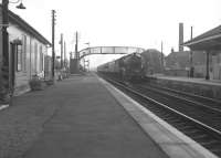 View south at Glengarnock in June 1963 as a Jubilee 4-6-0 approaches with an Ayr-Glasgow train. [See image 29987]<br><br>[Colin Miller /06/1963]